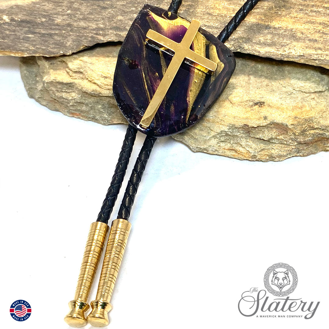 Black bolo tie with purple and gold accents and stainless steel cross