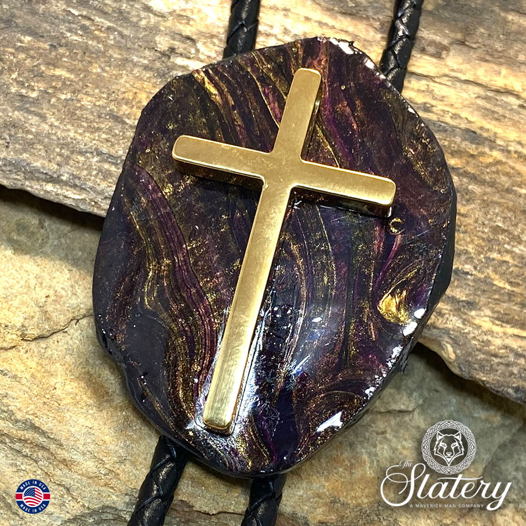 Black bolo tie with purple and gold accents and stainless steel cross