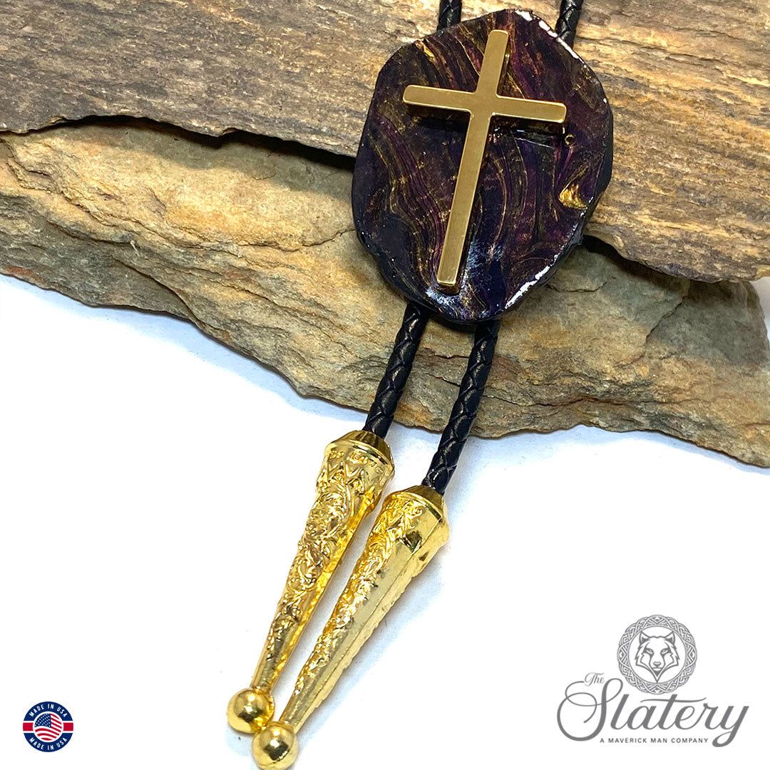 Black bolo tie with purple and gold accents and stainless steel cross