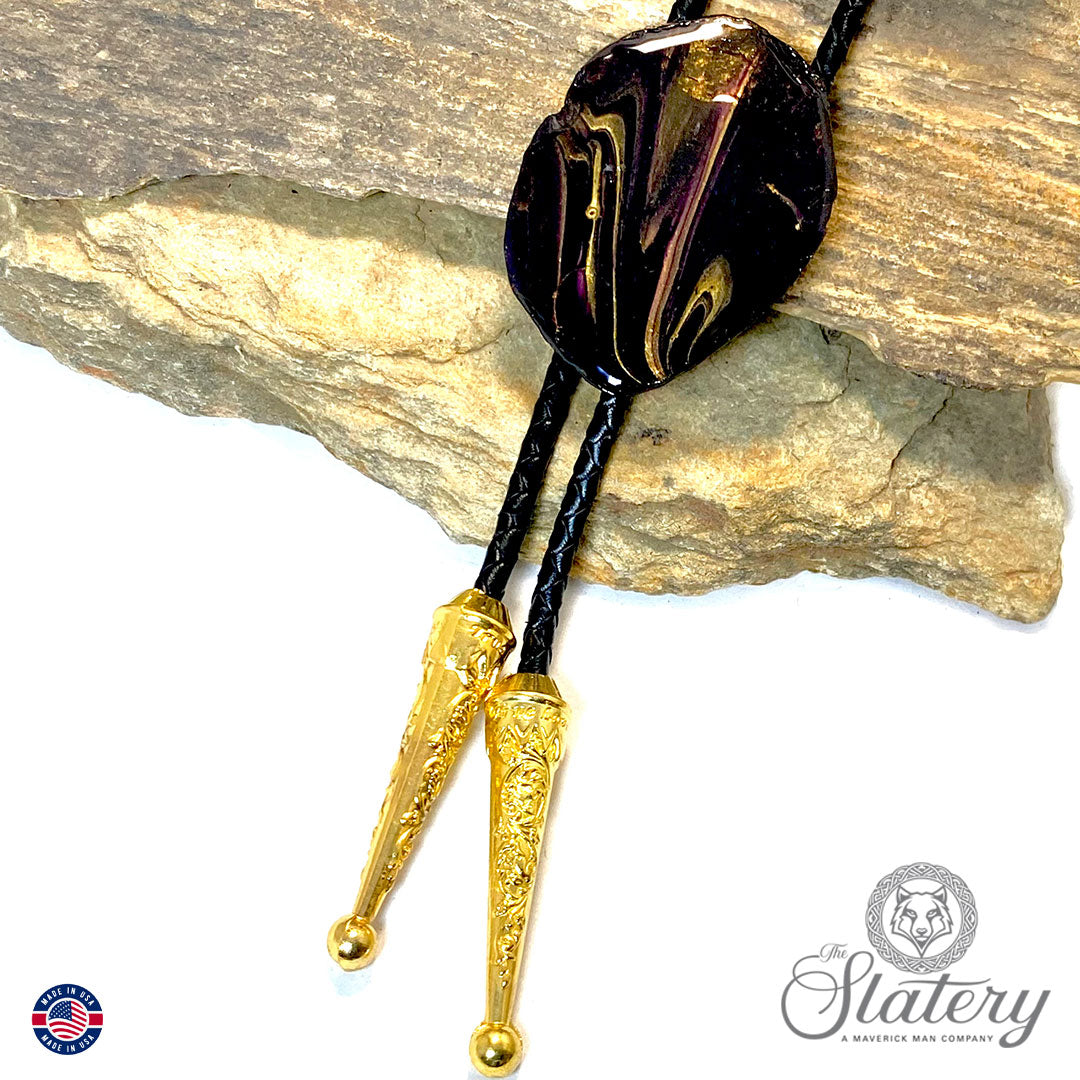 Black bolo tie with purple and gold accents made from slate