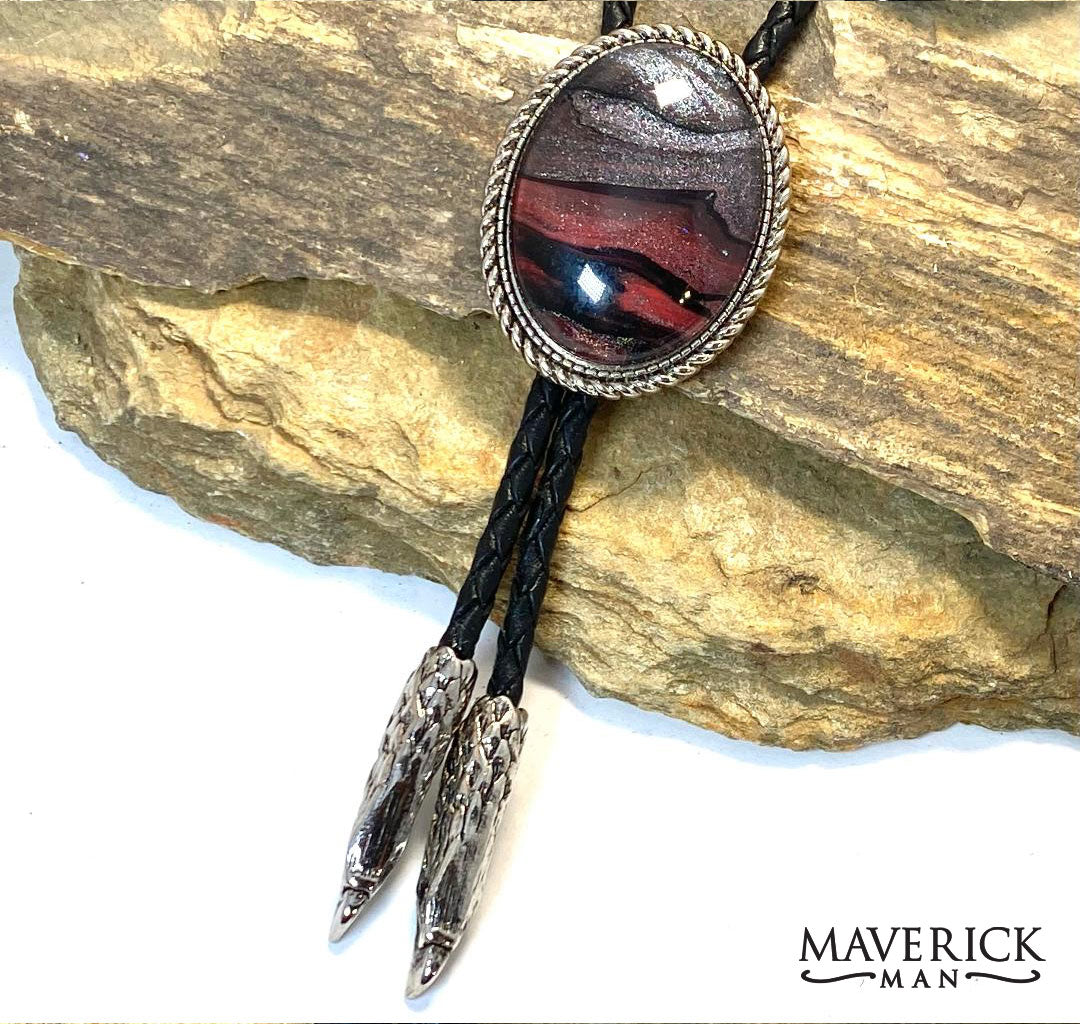 Red and black bolo tie with silver eagle tips