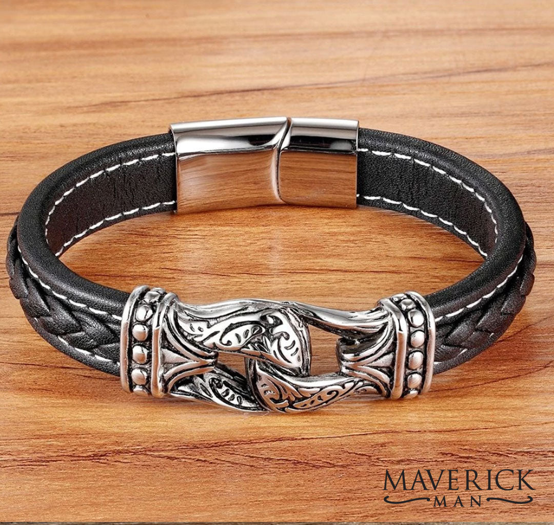 Braided leather bracelet with stainless steel filigree accents