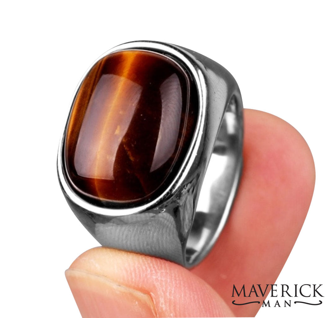 Eye-catching tainless steel ring with tiger eye looking wood stone