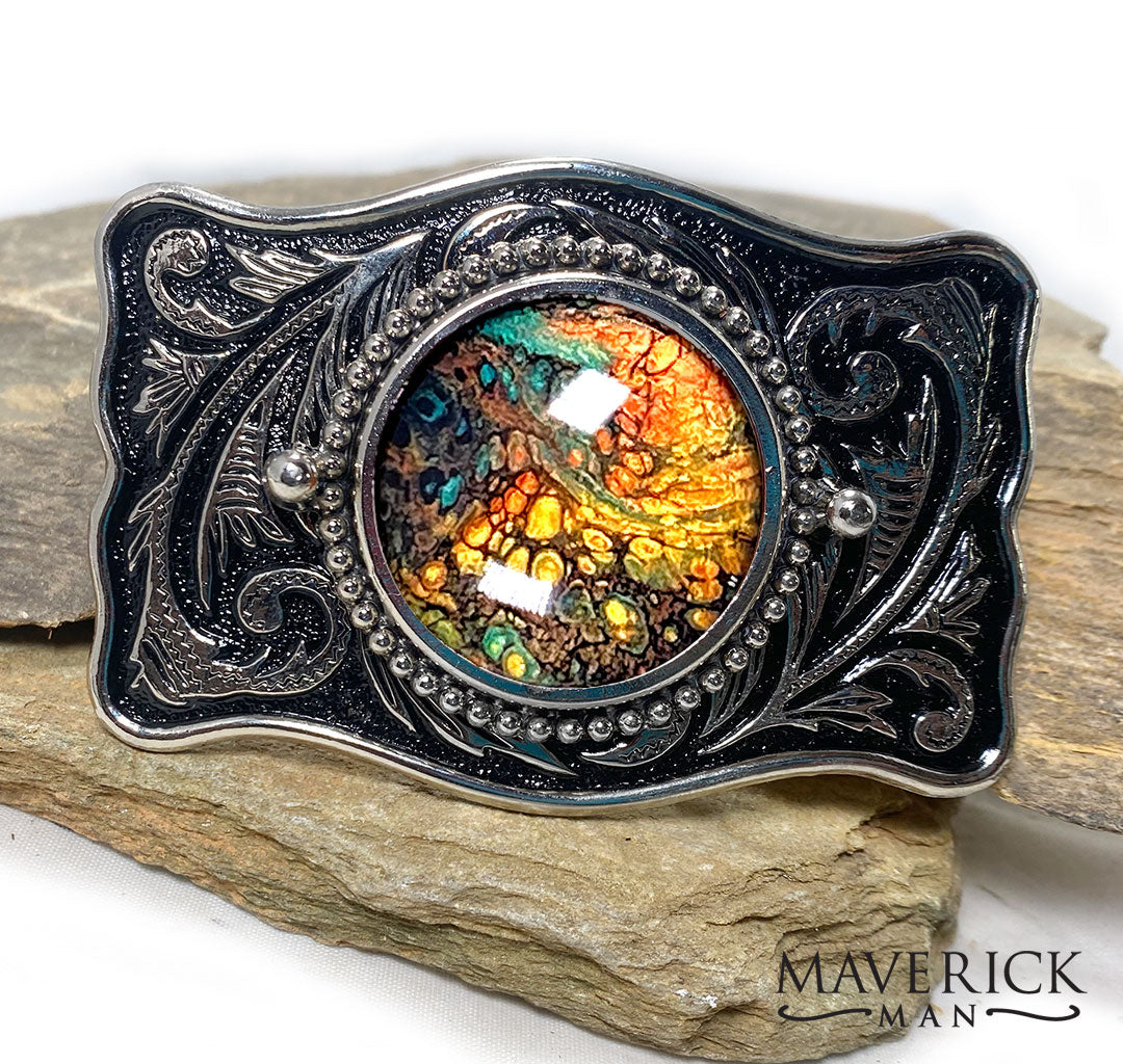Green earthtones in this black and silver buckle
