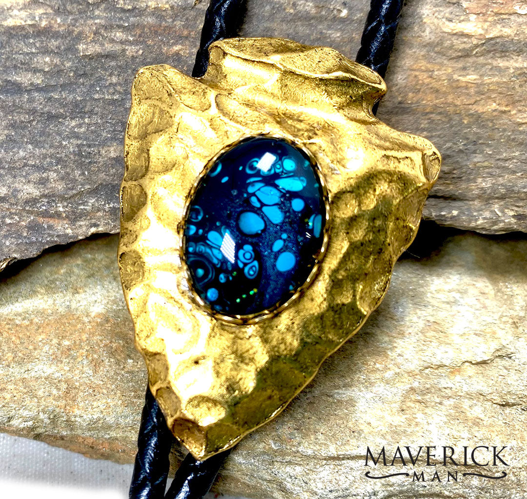 Golden hammered arrowhead bolo with hand painted turquoise and black stone