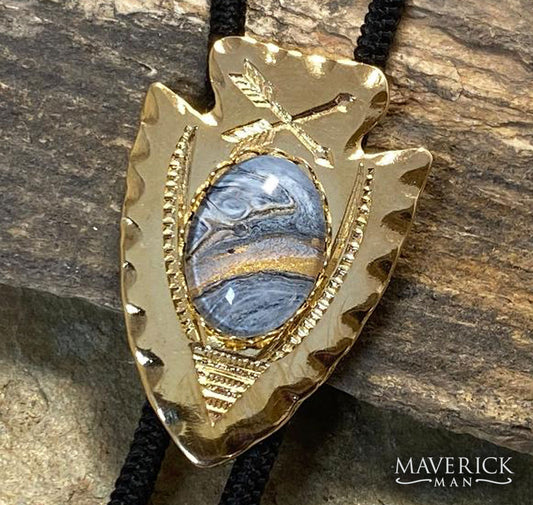 Golden arrowhead bolo with hand painted stone with platinum accents