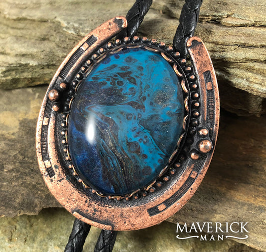 Copper horseshoe bolo with unusual blue stone