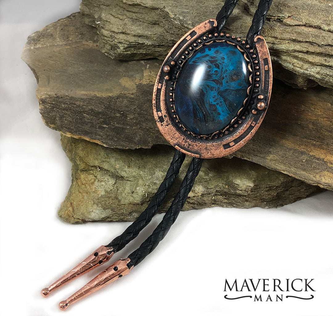 Copper horseshoe bolo with unusual blue stone