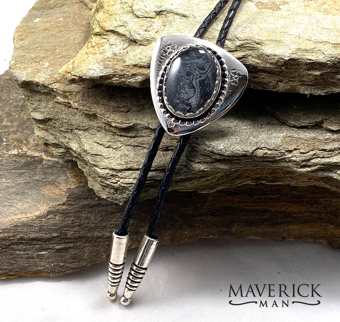 Unusual silver bolo with hand painted black and platinum stone